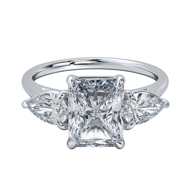 Silver engagement ring with a radiant cut center diamond flanked by two pear-shaped side stones.