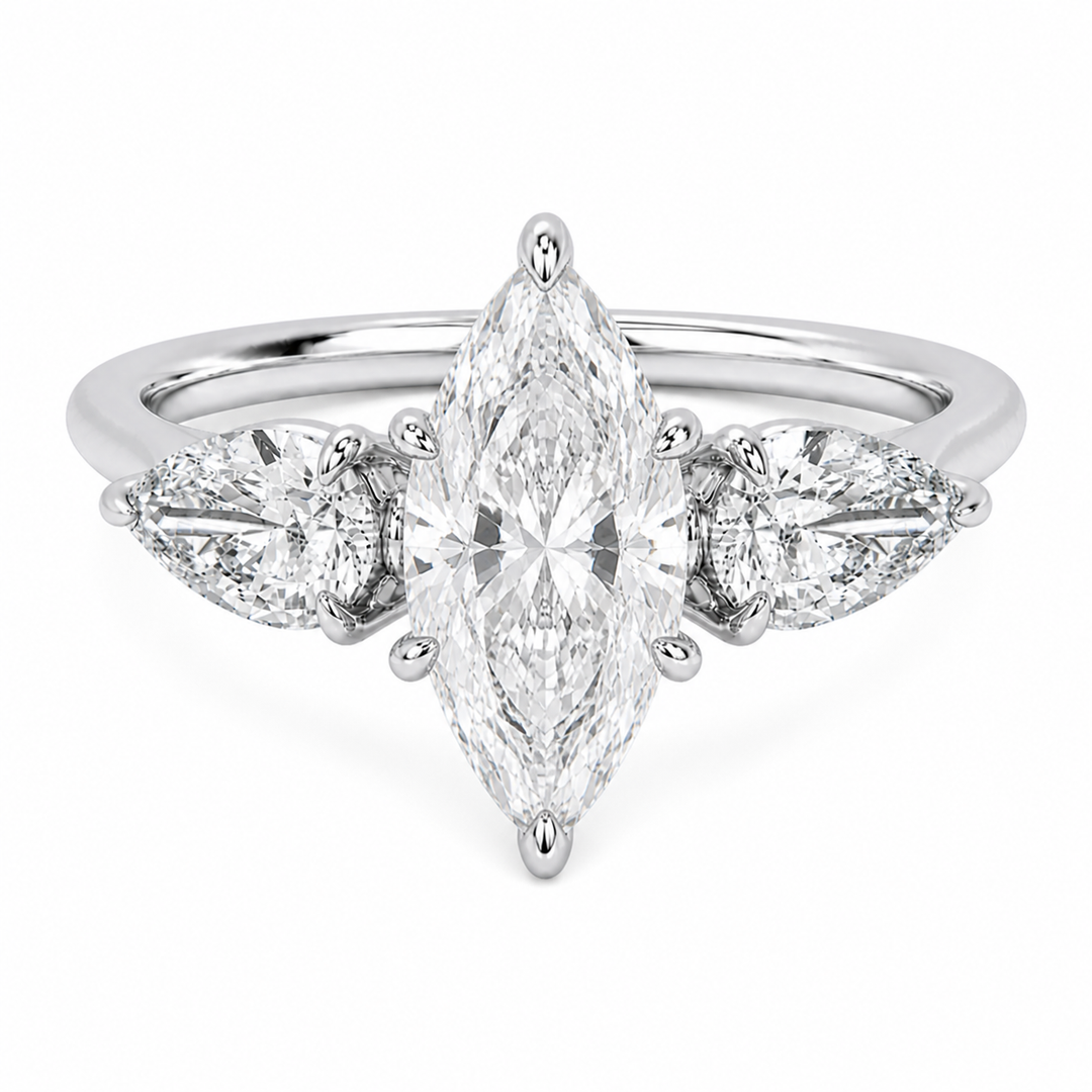 Ivy Signature engagement ring with a marquise center diamond and two pear side stones in 14K white gold.