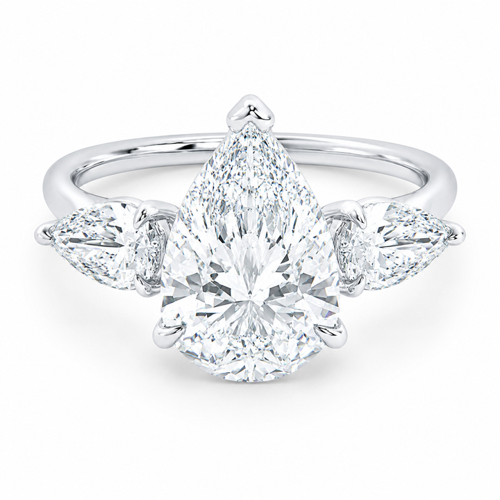Ivy Signature engagement ring: 14K white gold band with a large pear-cut center diamond flanked by two smaller pear side stones.