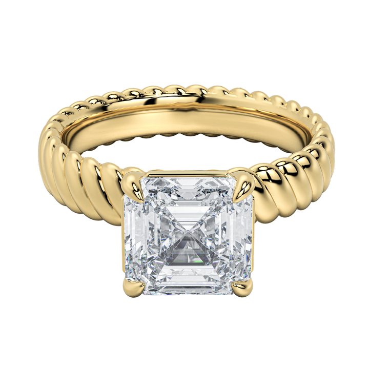 Jenn engagement ring with an emerald-cut diamond and intricate gold rope band.