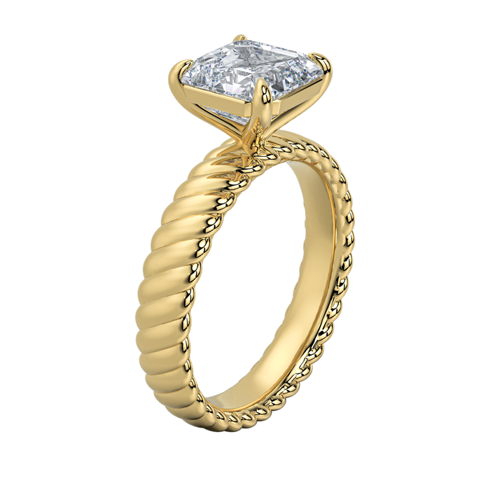 Jenn engagement ring: gold rope band with a sparkling emerald-cut diamond.
