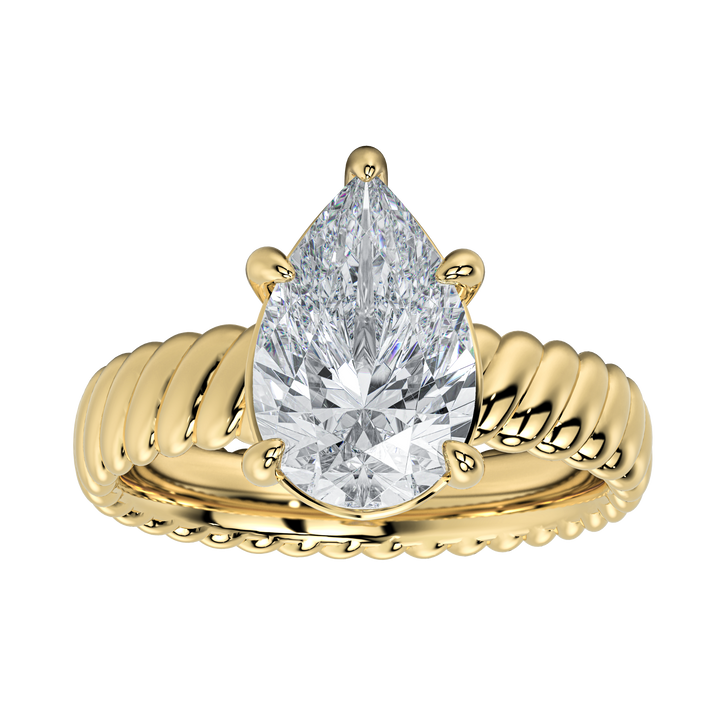 Jenn engagement ring with a pear-cut diamond center stone and a unique gold rope band.