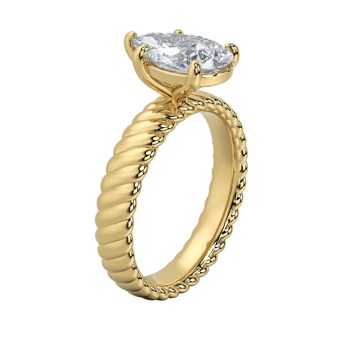 Jenn engagement ring: gold rope band with an emerald-cut diamond.