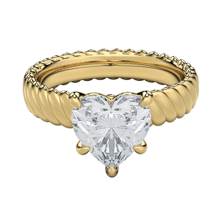 Jenn engagement ring: gold rope band with a heart-shaped diamond.