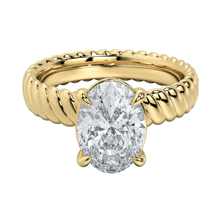 Jenn engagement ring with an oval diamond center stone and a yellow gold rope band.