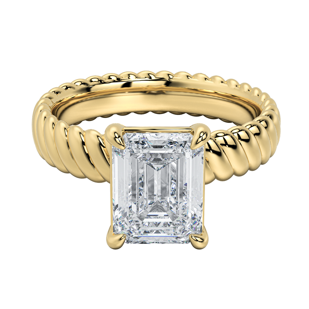 Jenn engagement ring: gold rope band with a prominent emerald-cut diamond.