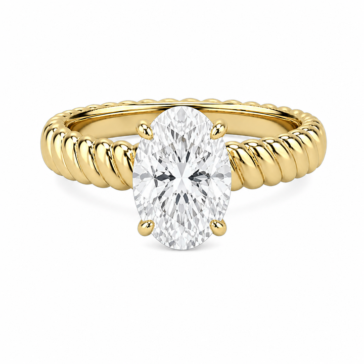 Jenn Signature engagement ring with an oval solitaire diamond on a 14K yellow gold rope band.