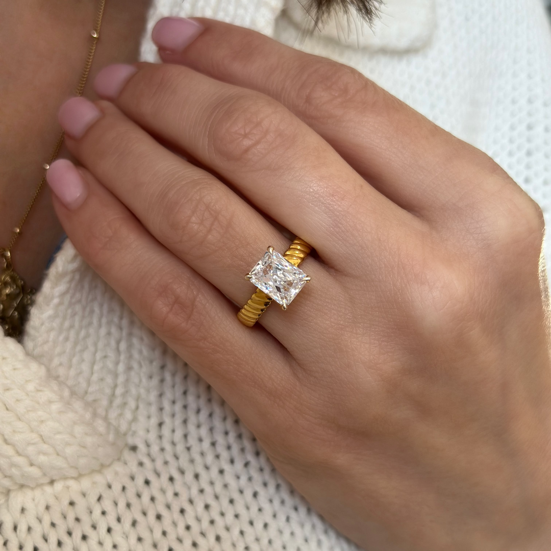 14K yellow gold Jenn Signature engagement ring with a 2 CT radiant cut diamond and a domed rope band.