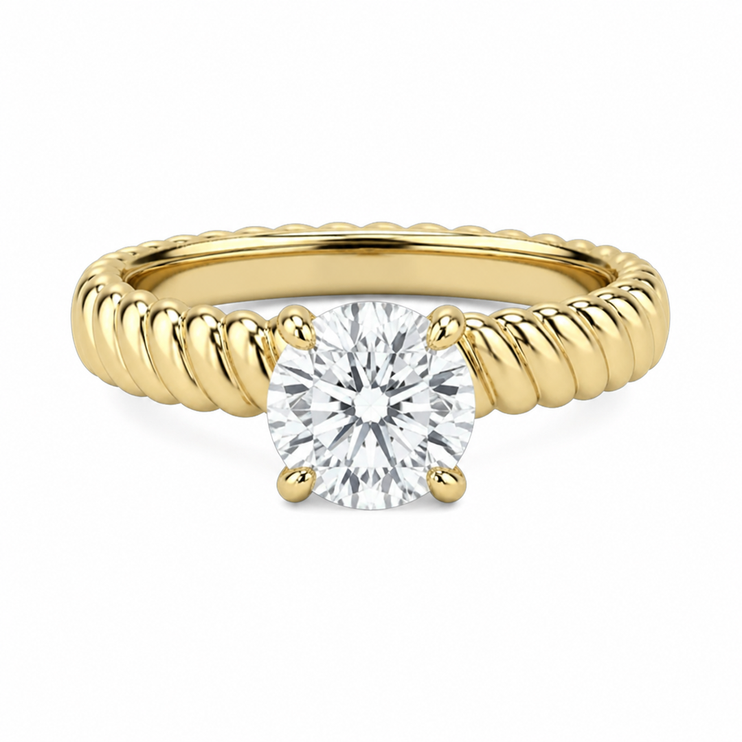 Jenn Signature engagement ring: 14K yellow gold rope band with a round solitaire diamond.