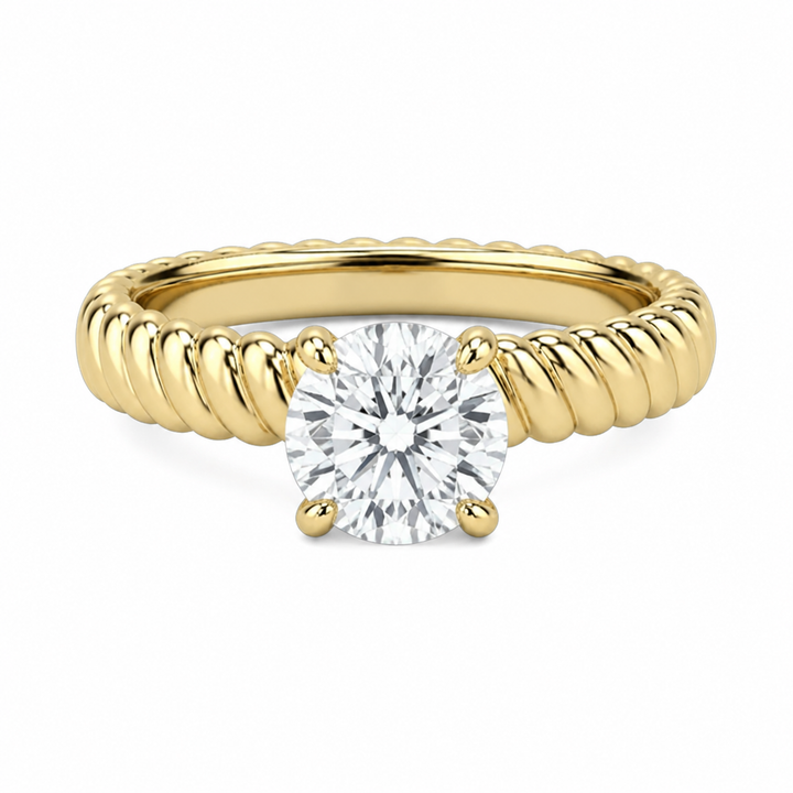 Jenn Signature engagement ring: 14K yellow gold rope band with a round solitaire diamond.