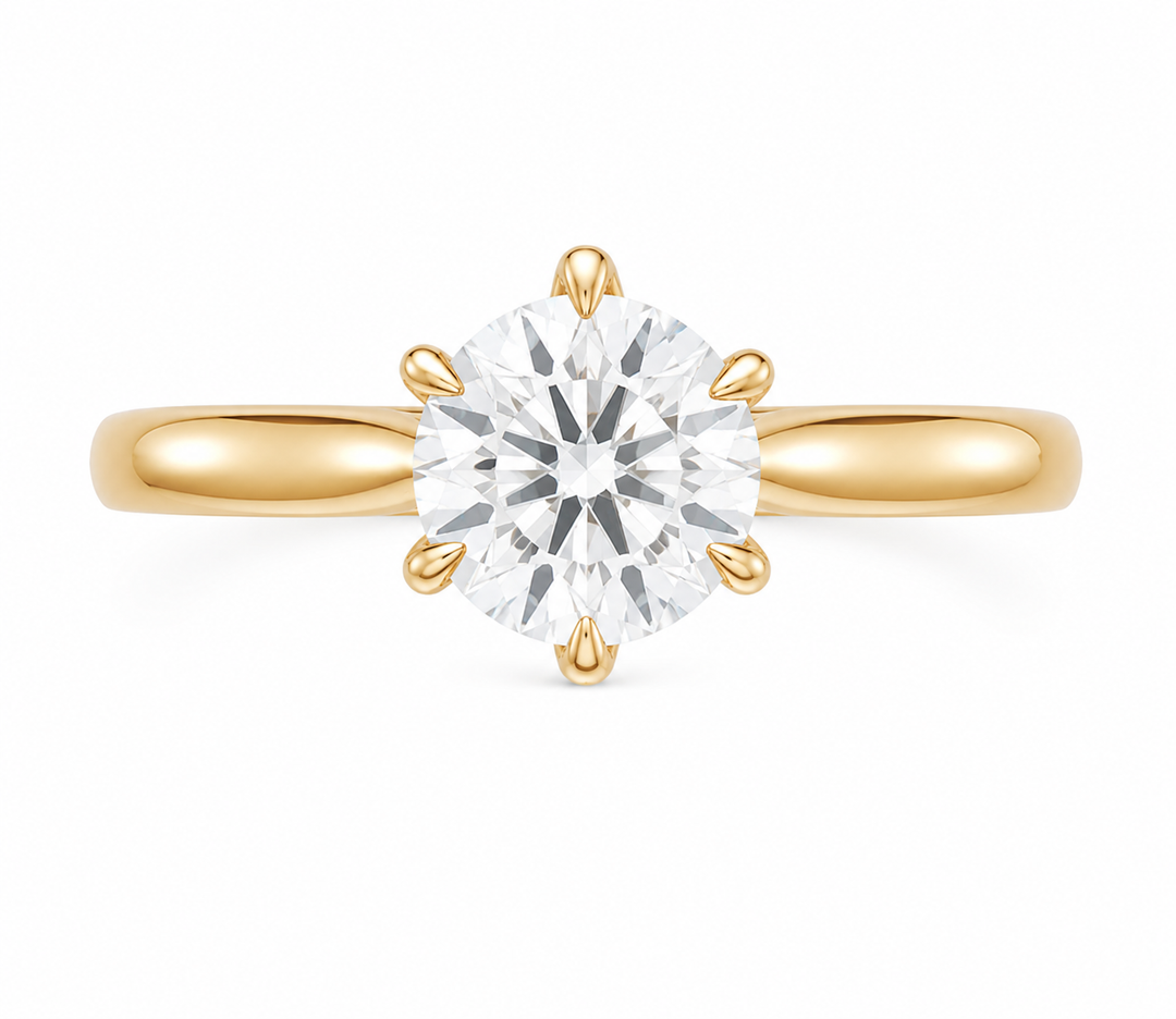 Leighton modern solitaire engagement ring in 14K gold with a 2 CT round diamond and claw prongs.