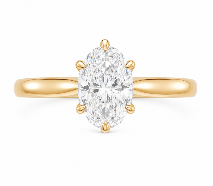Leighton Signature 14K gold engagement ring with a 2 CT oval diamond and claw prongs.