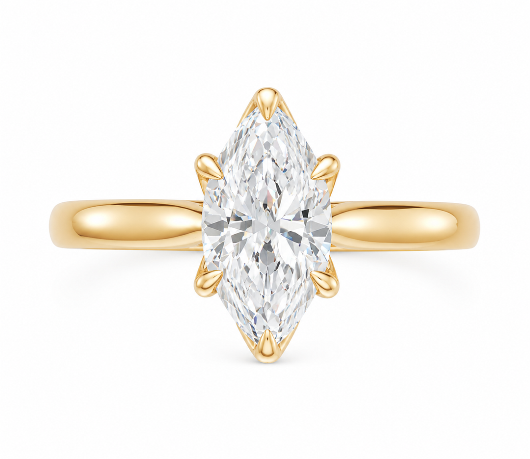 Leighton modern solitaire engagement ring in 14K yellow gold with a marquise diamond.