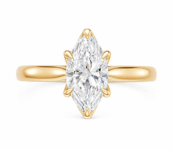 Leighton modern solitaire engagement ring in 14K yellow gold with a marquise diamond.