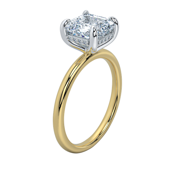 Margot solitaire engagement ring with a cushion-cut diamond, yellow gold band, and petite hidden halo.