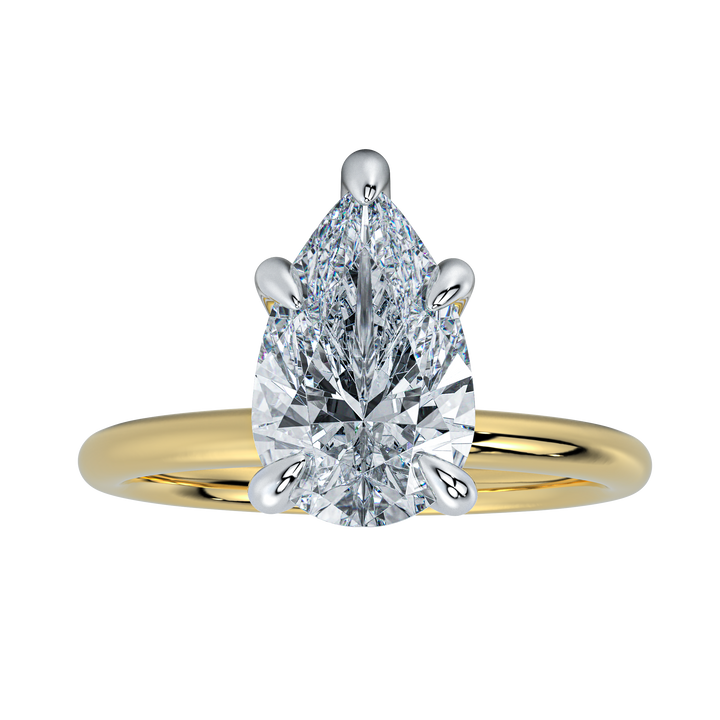 Margot engagement ring with a pear-shaped diamond, yellow gold band, and platinum prongs.