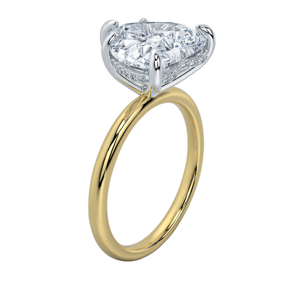Margot solitaire engagement ring with a cushion-cut diamond, yellow gold band, and petite hidden halo.
