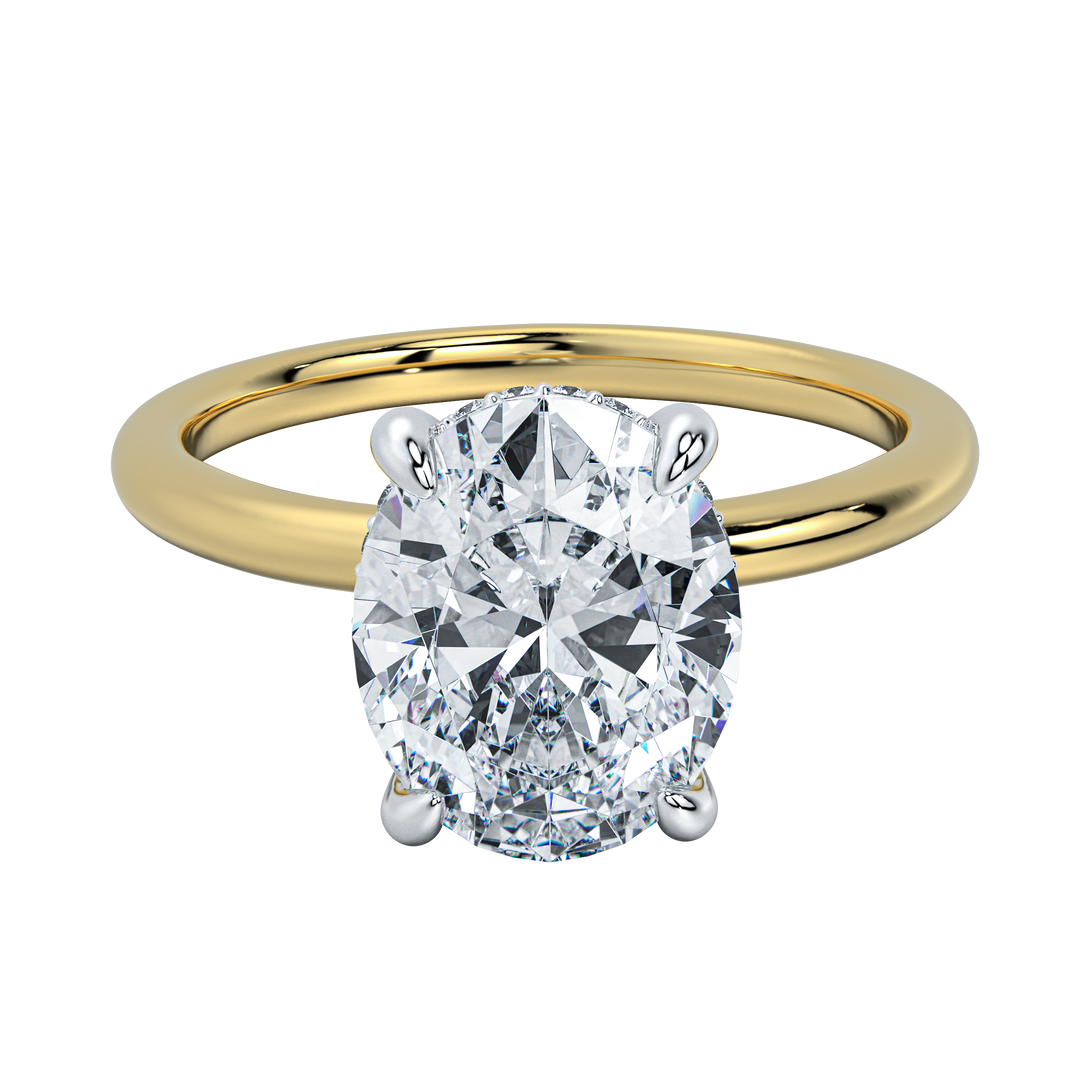 Margot solitaire engagement ring with an oval diamond, hidden halo, and yellow gold band.