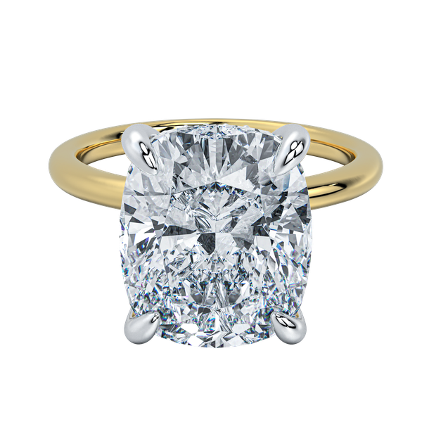 Margot solitaire engagement ring with a large cushion-cut diamond, yellow gold band, and white gold prongs.