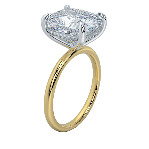 Margot solitaire engagement ring with a cushion-cut diamond, hidden halo, and yellow gold band.