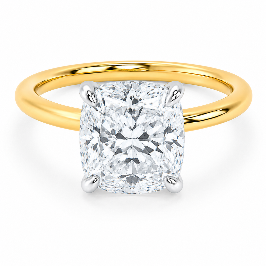 Margot engagement ring with a 2 CT cushion diamond, 14K yellow gold band, and white gold prongs.