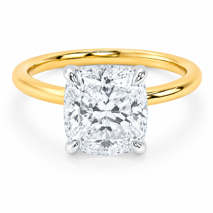 Margot engagement ring with a 2 CT cushion diamond, 14K yellow gold band, and white gold prongs.