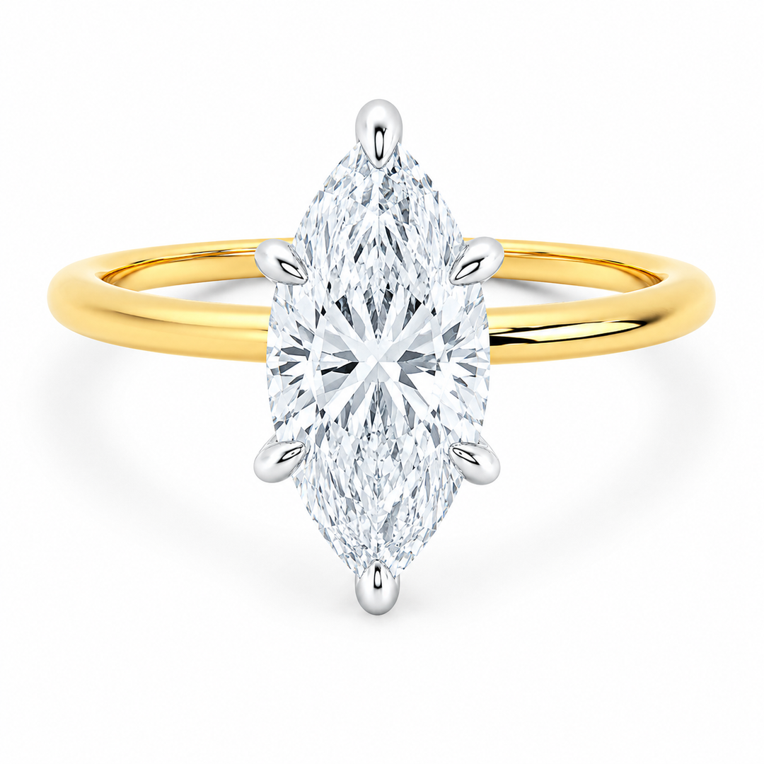 Margot Signature engagement ring with a marquise diamond, 14K yellow gold band, and white gold prongs.