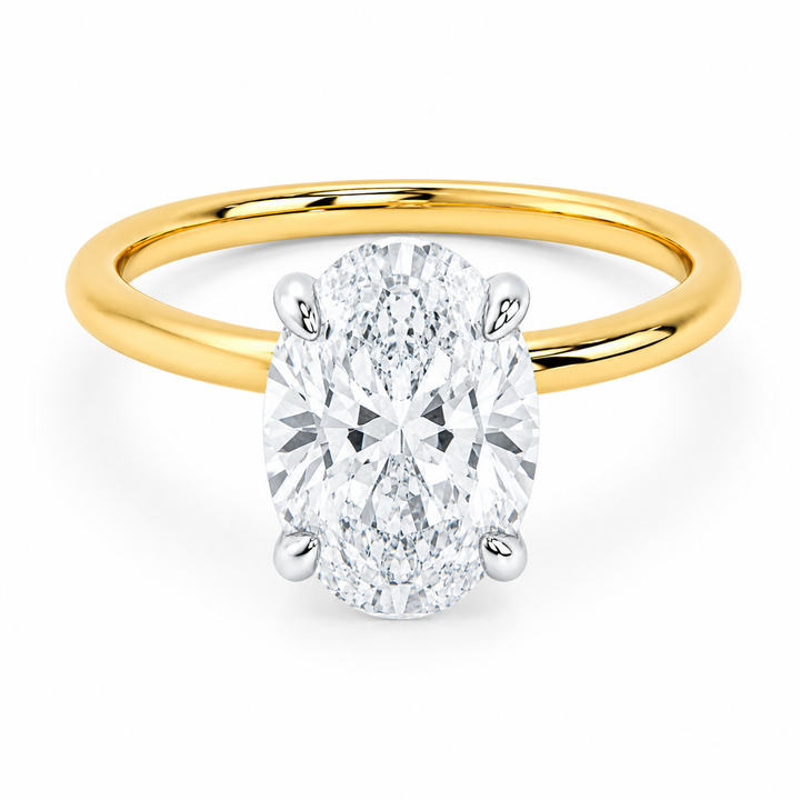 Margot engagement ring with a 2 CT oval diamond, 14K yellow gold band, and white gold prongs.