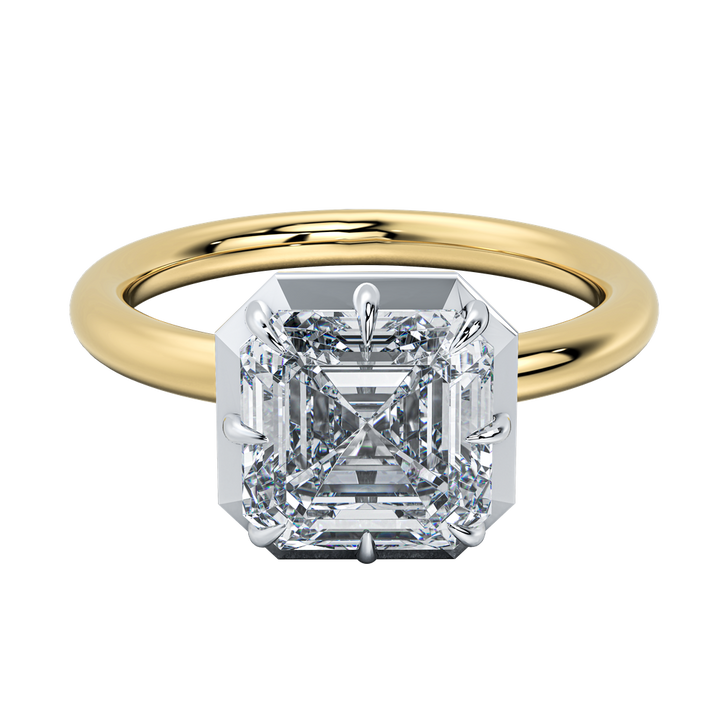 Taylor engagement ring: sleek emerald-cut diamond in a clean bezel setting on a gold band.