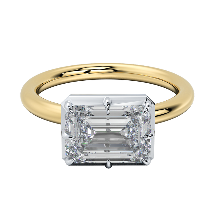Taylor emerald-cut diamond engagement ring with a sleek bezel setting on a gold band.