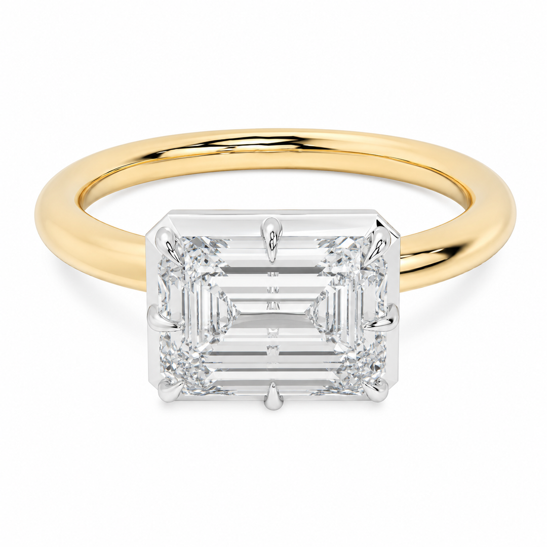 14K yellow and white gold Taylor engagement ring with an emerald-cut diamond and claw prongs.