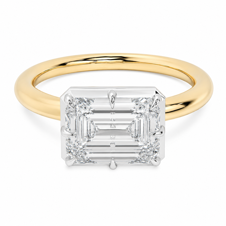 14K yellow and white gold Taylor engagement ring with an emerald-cut diamond and claw prongs.