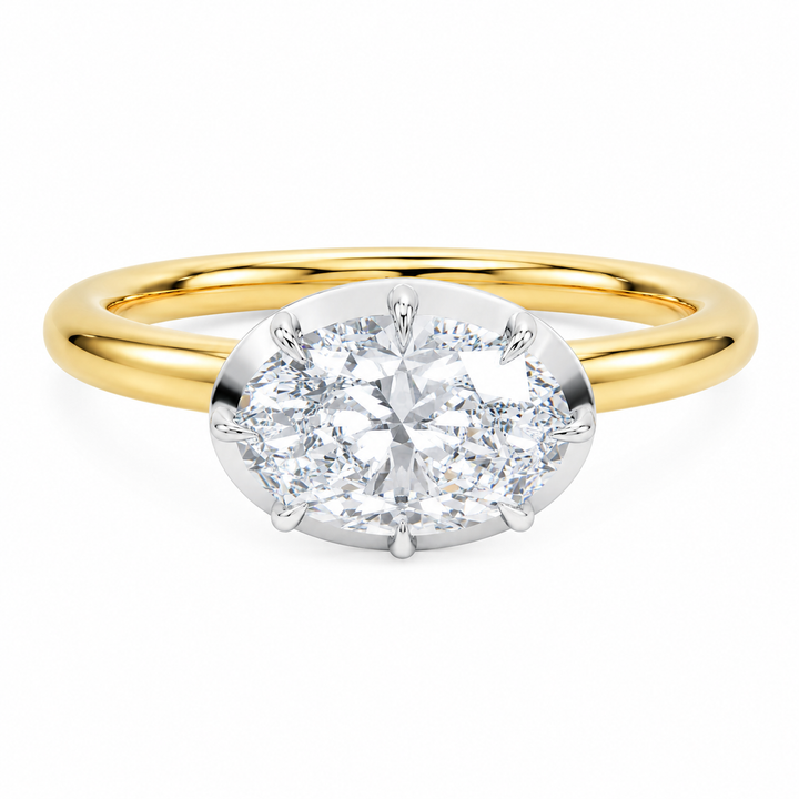 Taylor engagement ring with 2 CT oval diamond, 14K yellow gold band, and white gold claw prongs.