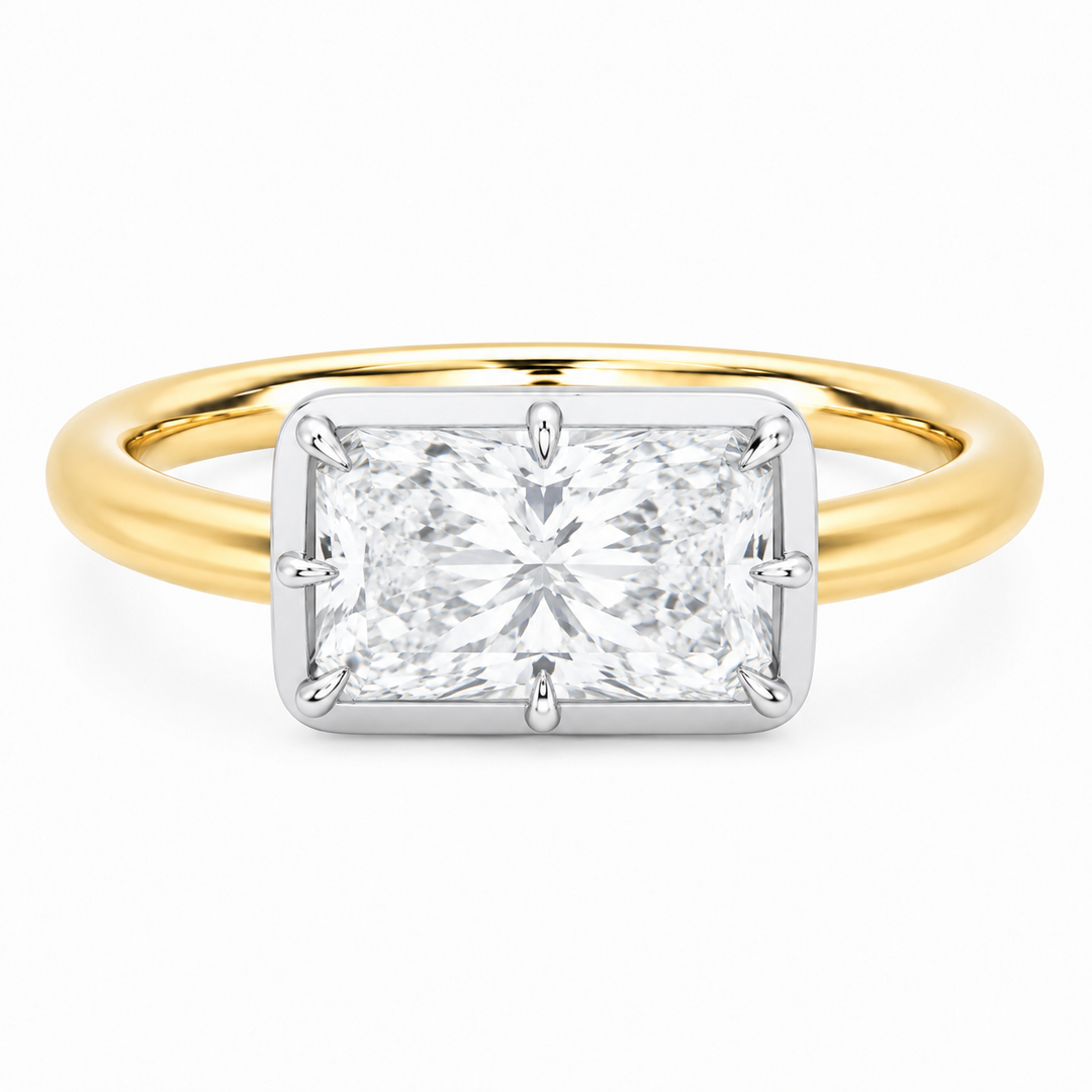Taylor two-tone 14K yellow and white gold engagement ring with a radiant cut diamond and claw prongs.