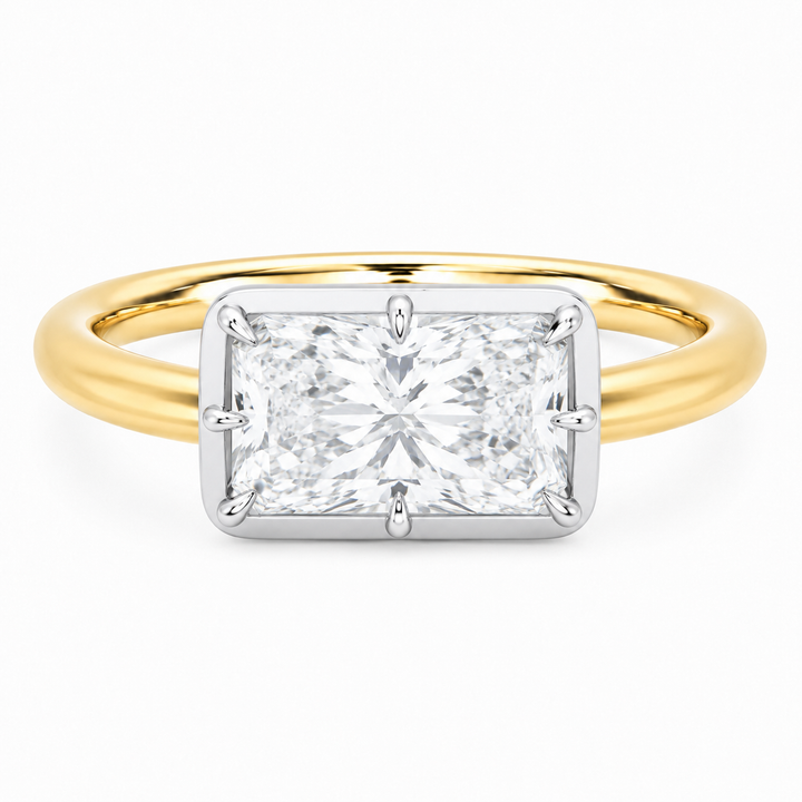 Taylor two-tone 14K yellow and white gold engagement ring with a radiant cut diamond and claw prongs.